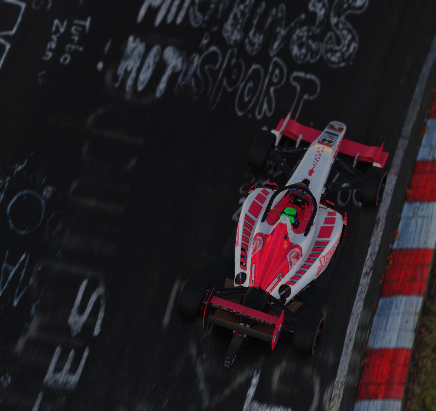 A Super Formula Lights from top-down view as it races past some of the drawings on the Nordschleife