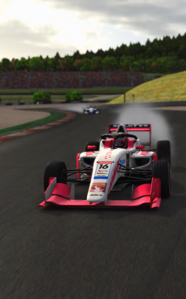 A Super Formula Lights car racing through the first banked turn at Zandvoort